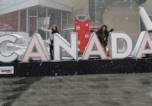 Students in front of a Canada sign. 
